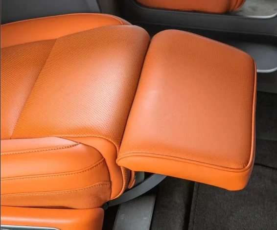 Car seat integrated leg rest