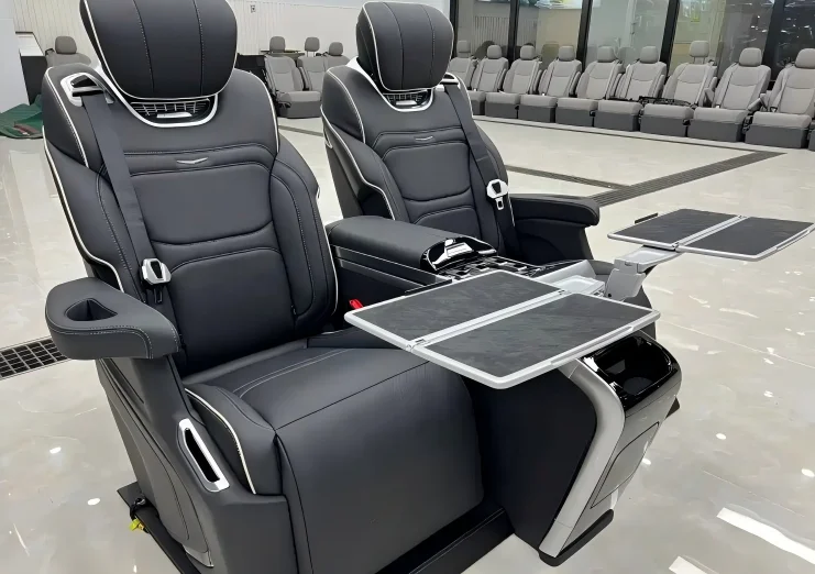 5-Side view of the Cadillac Escalade's luxury rear seat with the small table deployed.