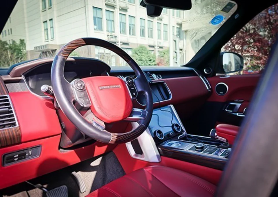 1-Modified steering wheel and front seats of the Land Rover