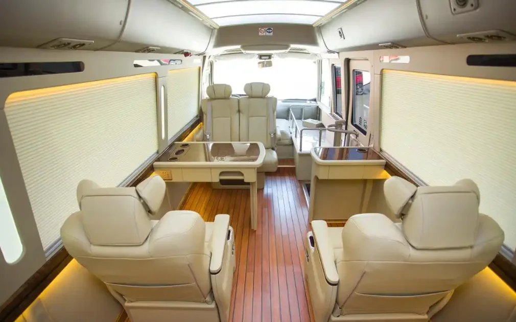 2-4-Toyota Coaster luxury bus interior with aviation seats, wood flooring and ambient lighting design